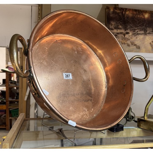 287 - A large copper pan.