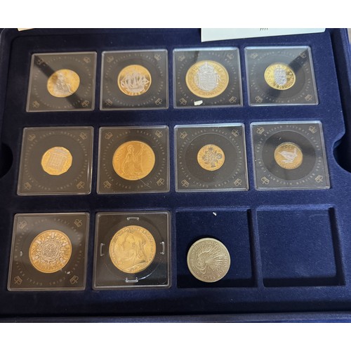 290 - Eleven gold plated commemorative coins with certificates in a case.