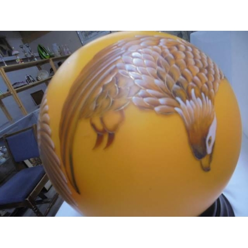 600A - An unusual globe shaped table lamp featuring an eagle.