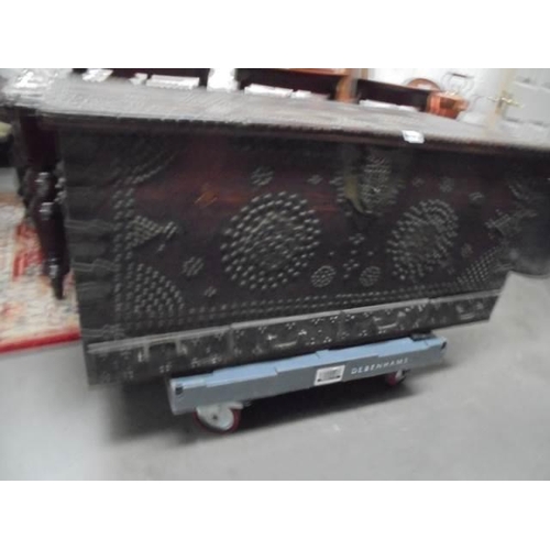 600L - A large old trunk with metal stud decoration.