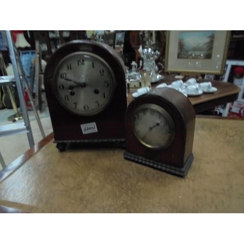 600N - Two old arched top mantel clocks.