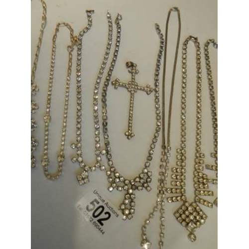 502 - Eight pieces of diamonte' jewellery including cross pendant.