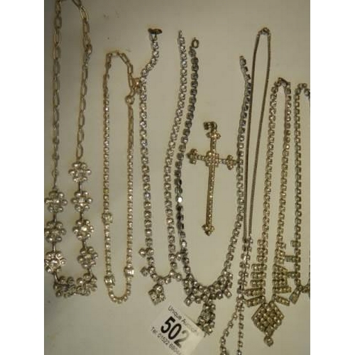 502 - Eight pieces of diamonte' jewellery including cross pendant.