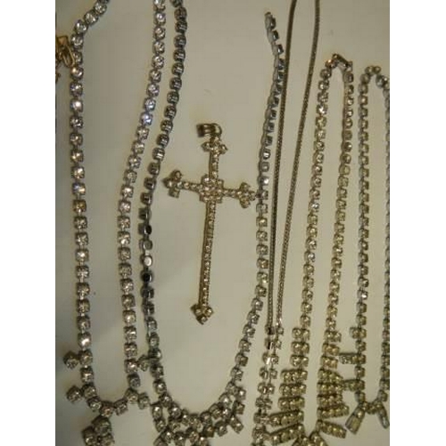 502 - Eight pieces of diamonte' jewellery including cross pendant.