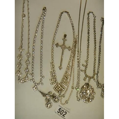 502 - Eight pieces of diamonte' jewellery including cross pendant.