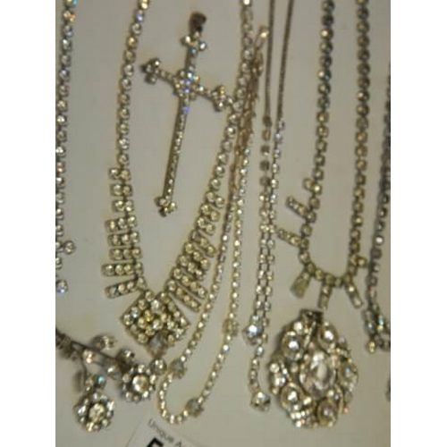 502 - Eight pieces of diamonte' jewellery including cross pendant.