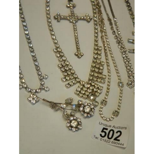 502 - Eight pieces of diamonte' jewellery including cross pendant.