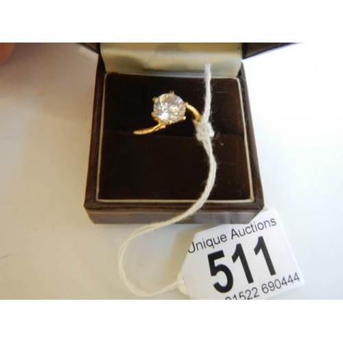 511 - A single stone gilded dress ring.