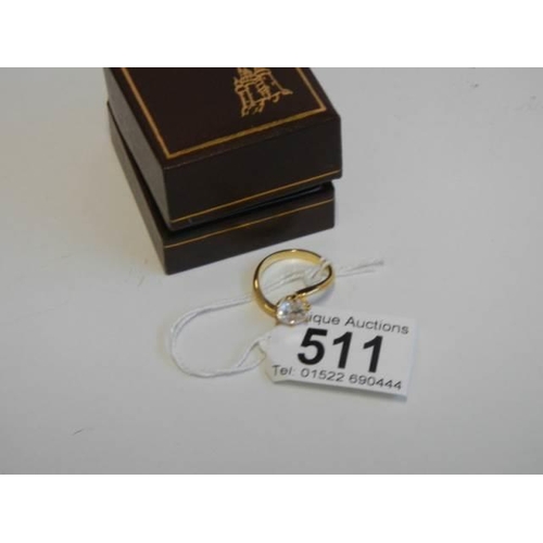 511 - A single stone gilded dress ring.