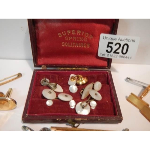 520 - A mixed lot of cuff links, tie pins etc.,