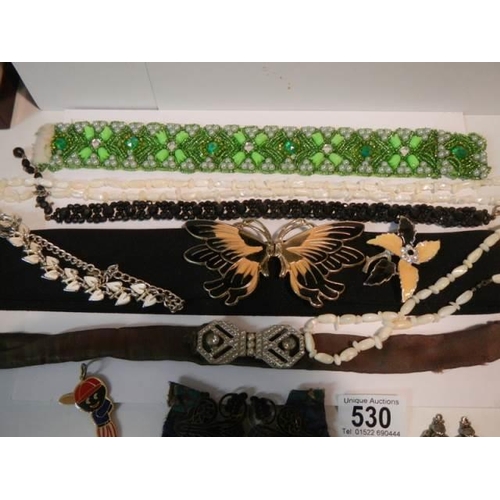 530 - A mixed lot of costume jewellery, belts etc.,