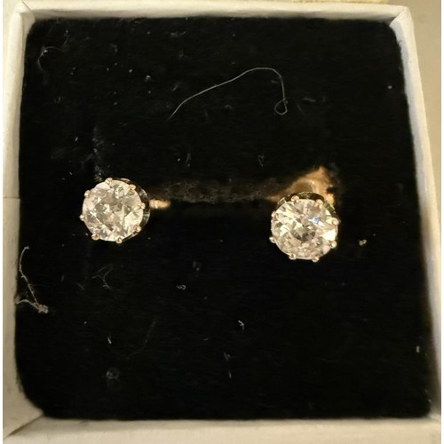 36 - A pair of 9ct gold and diamond stud earrings.