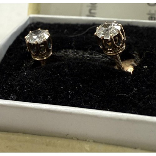 36 - A pair of 9ct gold and diamond stud earrings.