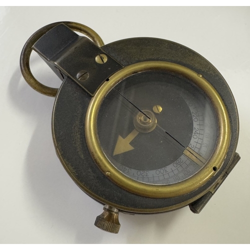 546 - An early military cased compass & An army handkerchief