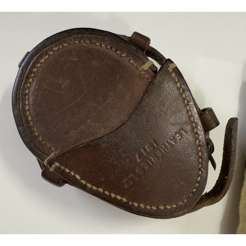 546 - An early military cased compass & An army handkerchief