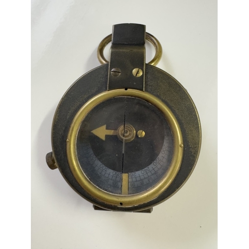 546 - An early military cased compass & An army handkerchief