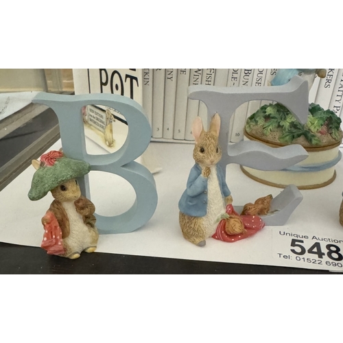 548 - A cased set of Beatrix Potter 'The World Of Peter Rabbit, A trinket box & 4 letters (BENE)