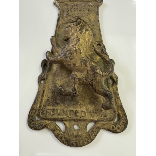 551 - A vintage brass Harrow school door knocker Rd No 553858