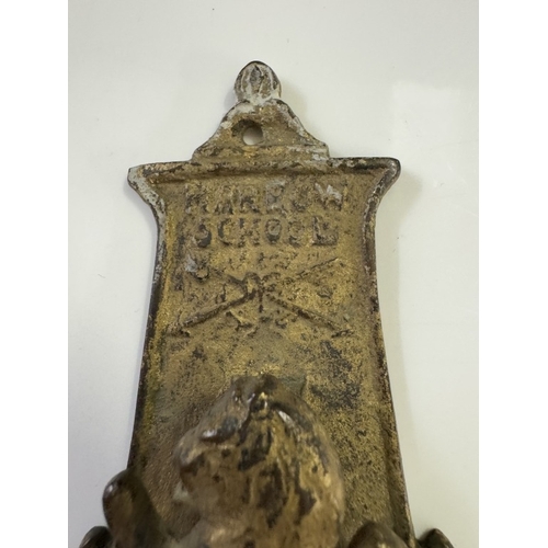 551 - A vintage brass Harrow school door knocker Rd No 553858