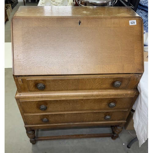 629 - A 1930's oak/ply bureau