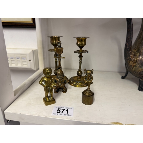 571 - A brass Lincoln imp candle snuffer, policeman door knocker, pair of candlesticks etc