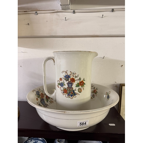 584 - An Edwardian floral decorated wash basin & jug