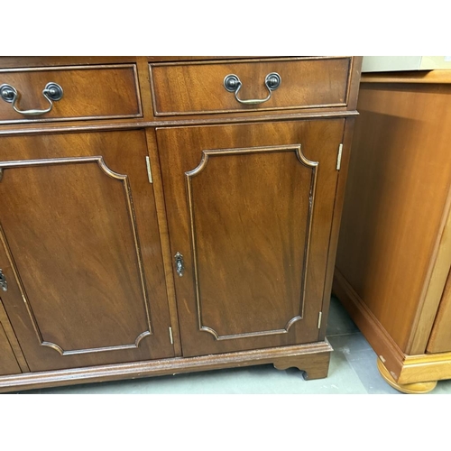 590 - A dark wood stained 3 drawer 3 door wall unit