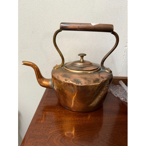 591 - A Victorian copper kettle & A lidded pot