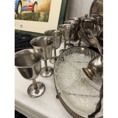 598 - A large selection of metalware including silver plate, stainless steel etc