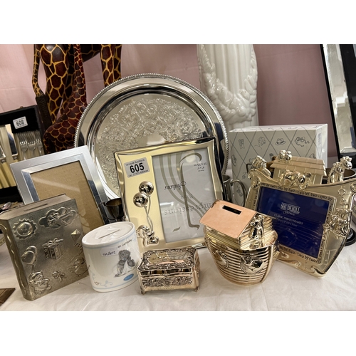 605 - A selection of baby themed merchandise including picture frames & money boxes