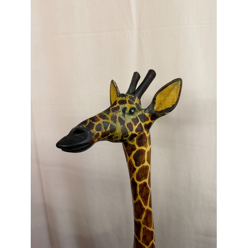 607 - 2 realistic carved wooden giraffes, height 90cm & 44cm