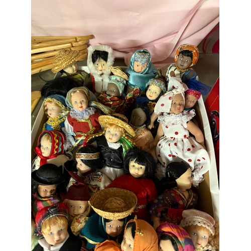 611 - A good collection of international dress porcelain Dolls