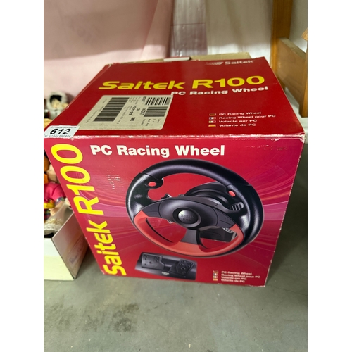 612 - A boxed Saitek R100 P.C. racing wheel