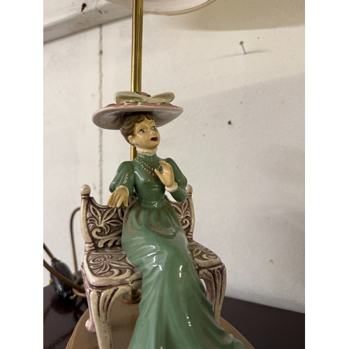 616 - A vintage ceramic table lamp of a seated lady