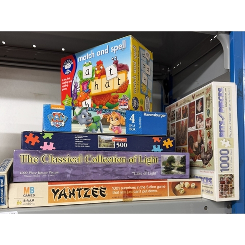 653 - A quantity of jigsaw puzzles & games (contents unchecked)