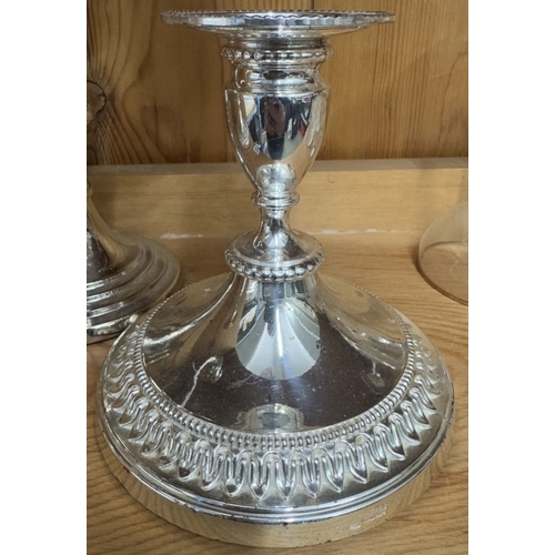 661 - A silver plate candelabra and a pair of silver plate candlesticks.