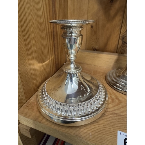 661 - A silver plate candelabra and a pair of silver plate candlesticks.