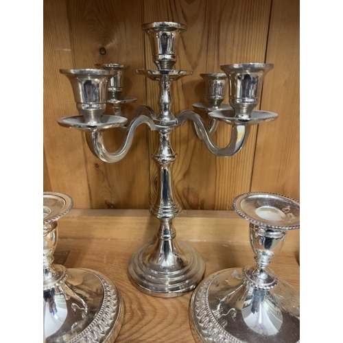 661 - A silver plate candelabra and a pair of silver plate candlesticks.