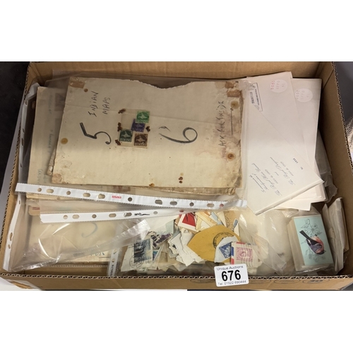 676 - A box of loose stamps & albums etc.