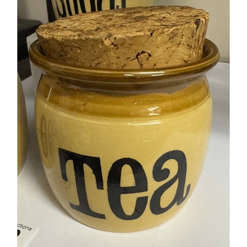 682 - A stoneware T.G. Green tea, coffee & sugar storage jars with cork stoppers