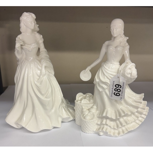 689 - A pair of unbranded white glazed ceramic figurines