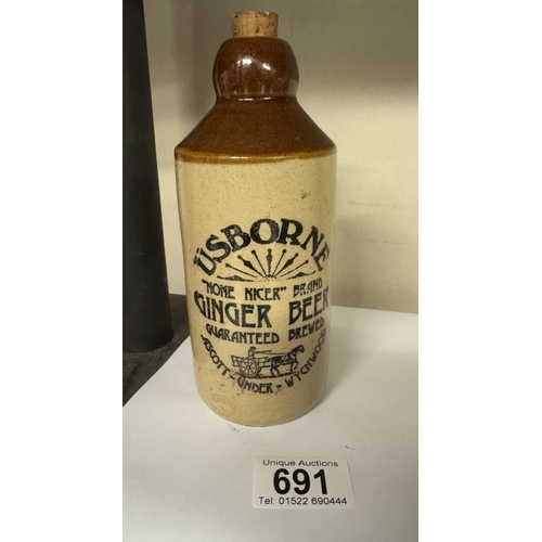 691 - A stoneware Usborne ginger beer bottle with rare paper label