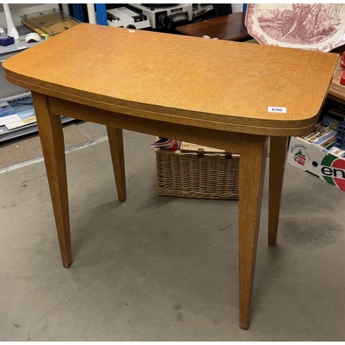 696 - A 1950's oak fold over tea/card table