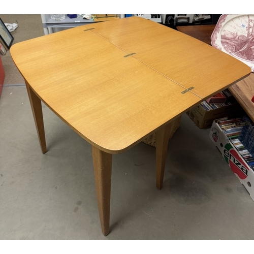 696 - A 1950's oak fold over tea/card table