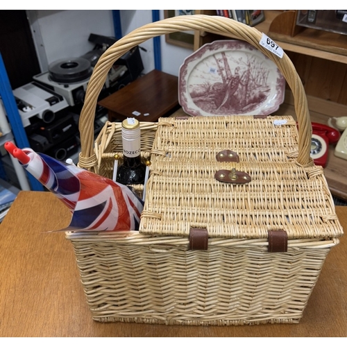 697 - A picnic hamper with contents & a bottle of alcohol free merlot wine