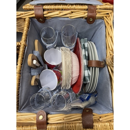 697 - A picnic hamper with contents & a bottle of alcohol free merlot wine