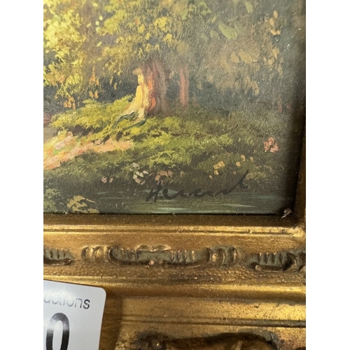 700 - A gilt framed over painted print of a woodland scene