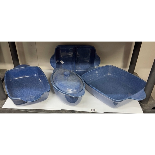 702 - A quantity of  heavy blue glazed cookware including roasting pans