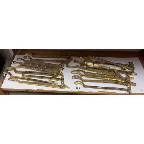 725 - A quantity of brass window catches