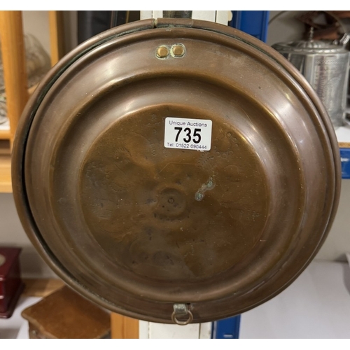 735 - A Victorian copper warming pan.